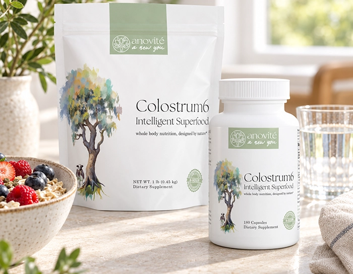 Anovité Colostrum6 powder pouch and 180 Capsules bottle beside breakfast and water